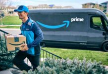 Amazon driver delivers a parcel next to a Prime van.