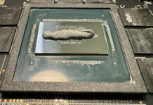 An Nvidia GPU die covered with a line of thermal paste