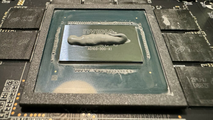 An Nvidia GPU die covered with a line of thermal paste