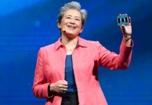 AMD CEO Dr. Lisa Su, holding a 5th Gen AMD EPYC CPU in her hand