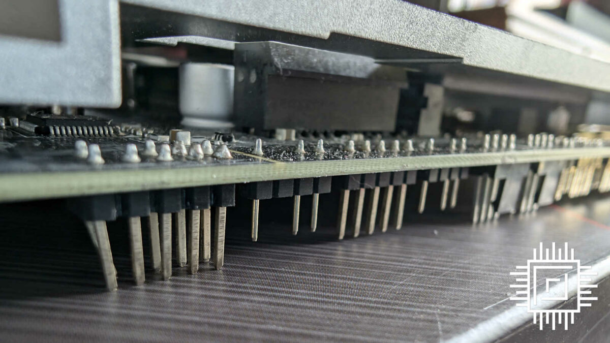 A close up of MSI B650M Project Zero, focussing on its pins resting on a box