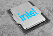 Intel processor in grayscale, with the company logo placed on top of it in blue