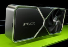 Nvidia GeForce RTX 4070 Founders Edition graphic card riding atop a green strip, in a dark environment