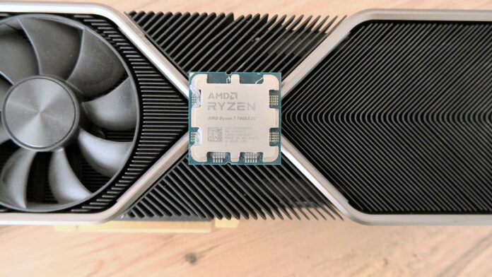 A picture of an AMD Ryzen 7800X3D on top of GeForce RTX 30 Series card.