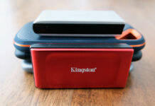 A picture of the Kingston XS1000 Red SSD alongside other drives.