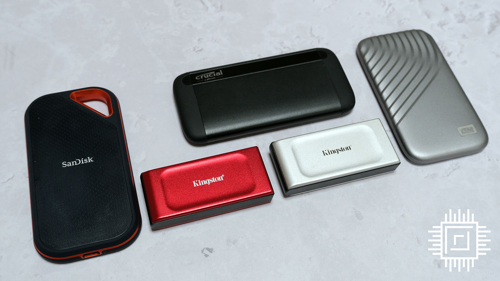 A picture showing the Kingston XS1000 Red 2TB with other drives.