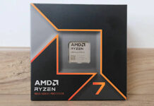 Ryzen 7 9700X in its retail packaging, resting on a wooden worktop