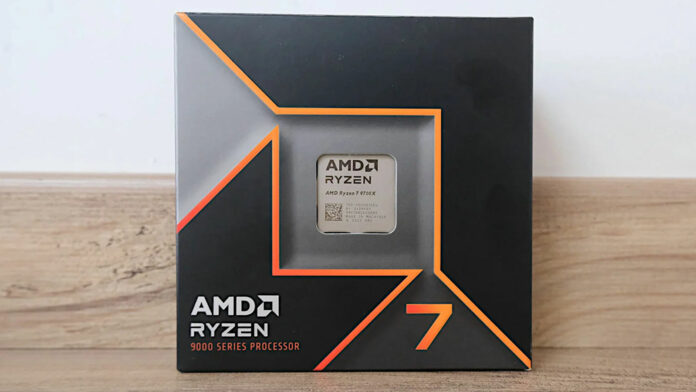 Ryzen 7 9700X in its retail packaging, resting on a wooden worktop