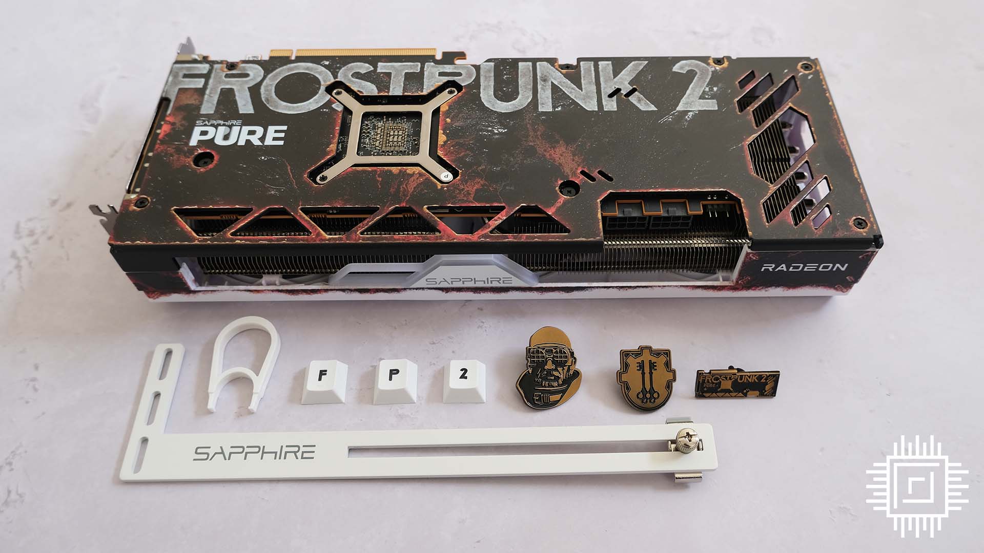 A picture of the Sapphire Radeon RX 7700 XT Frostpunk 2 card bundle.