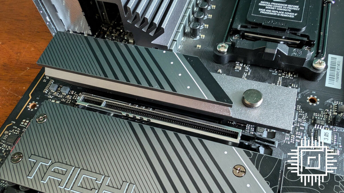 Close up of M.2 heatsink with EZ release mechanism, on ASRock X870E Taichi Lite.