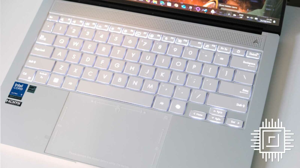 Asus Zenbook S 14 laptop keyboard with white backlight on.