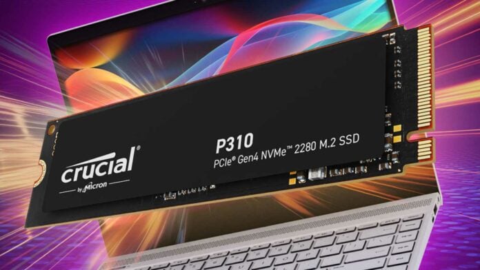 Crucial P310 SSD hovering in front of a laptop.