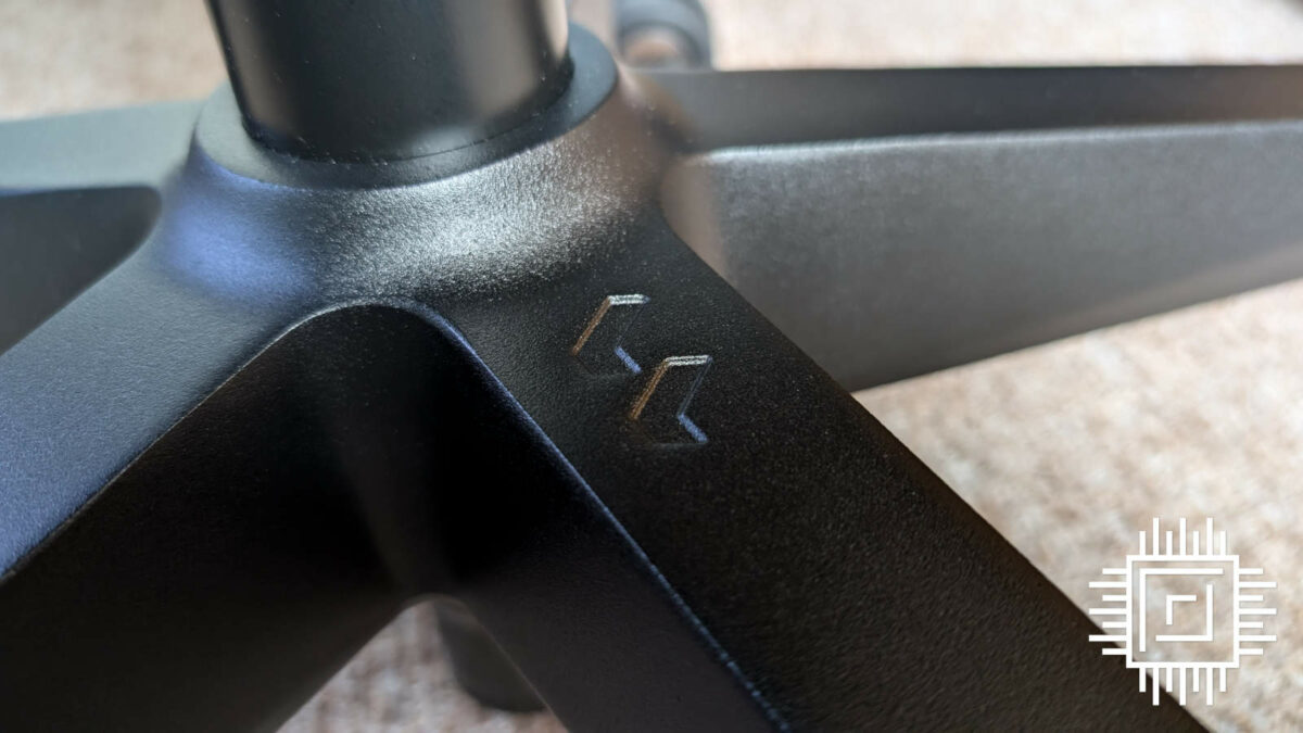 Close up of Fractal Design Refine metal cast legs, the company's 'F' logo serving as a focal point.