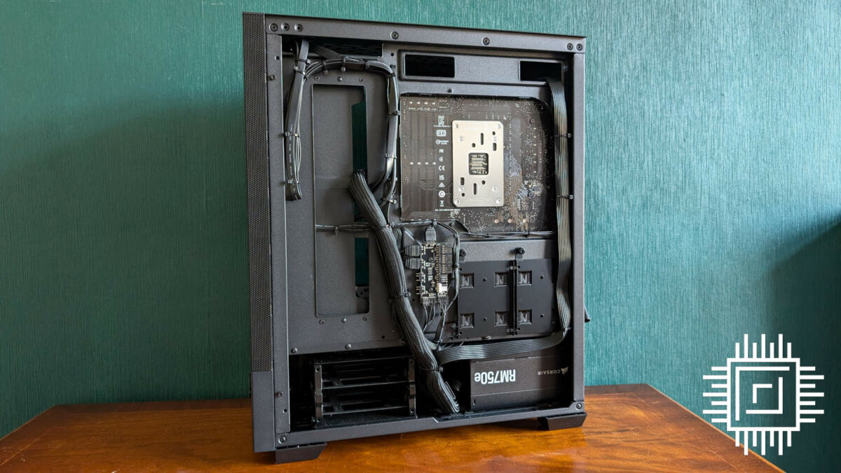 View of open back panel for PCSpecialist Helio Elite, featuring tidy cable management.