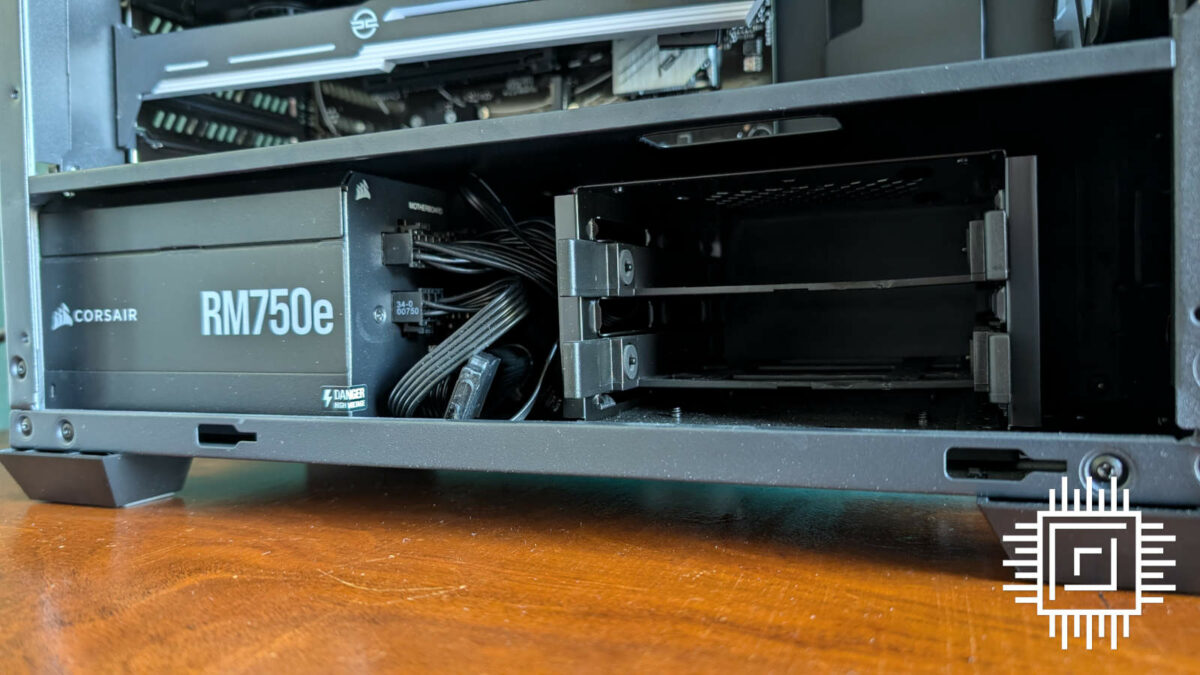 Close up of hidden compartment for PSU and 2.5/3.5in drives, inside PCSpecialist Helio Elite.