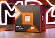 Ryzen 5 7600X3D in its retail packaging, with an AMD neon lego behind it