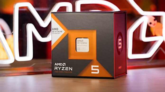 Ryzen 5 7600X3D in its retail packaging, with an AMD neon lego behind it