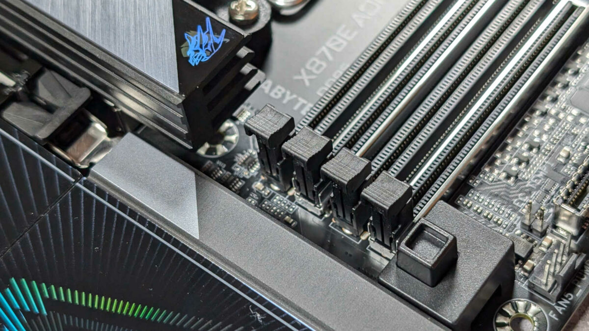 PCIe EZ-Latch Plus on X870E Aorus Pro, next to four DIMM slots.