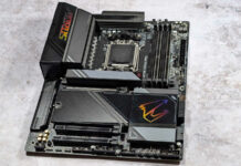 Wide shot of X870E Aorus Pro against a white stone surface.