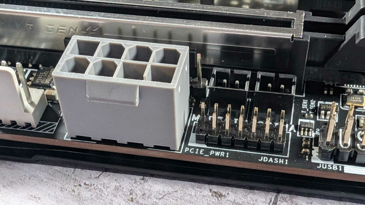 Close up of tertiary power connector (left) and JDASH1 header, for Tuning Controller accessory, on MEG Z890 Unify-X.