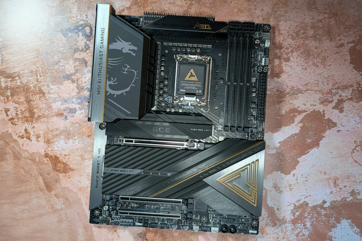 A wide shot of an MSI MEG Z890 Ace motherboard, against a rust-orange backdrop.