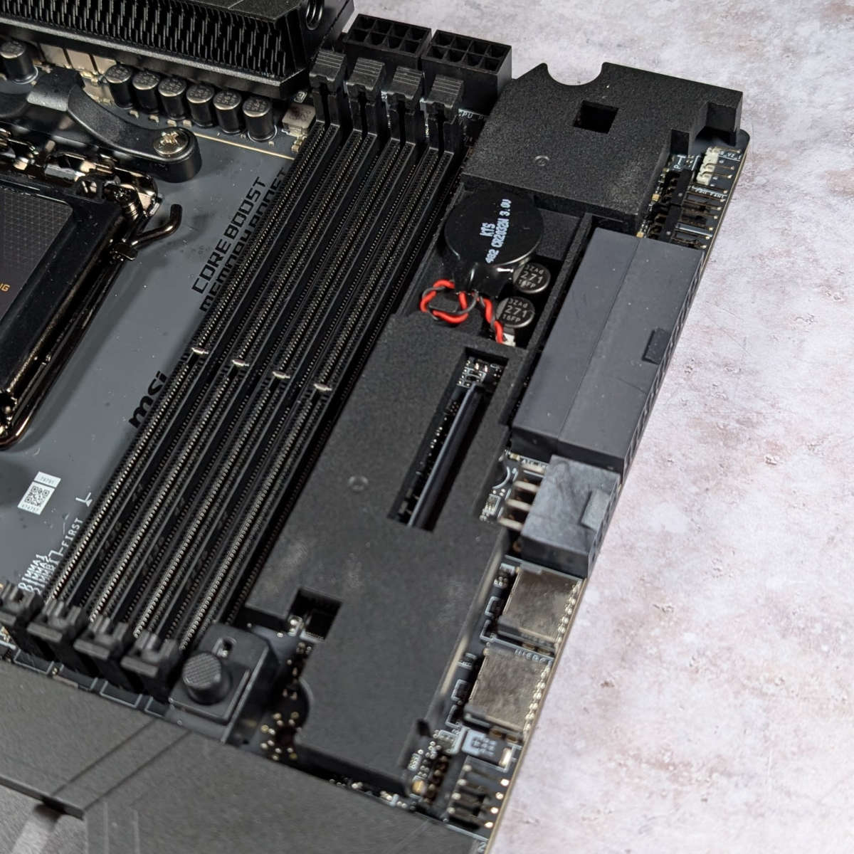 Close up of MEG X870E Godlike header for EZ Bridge.