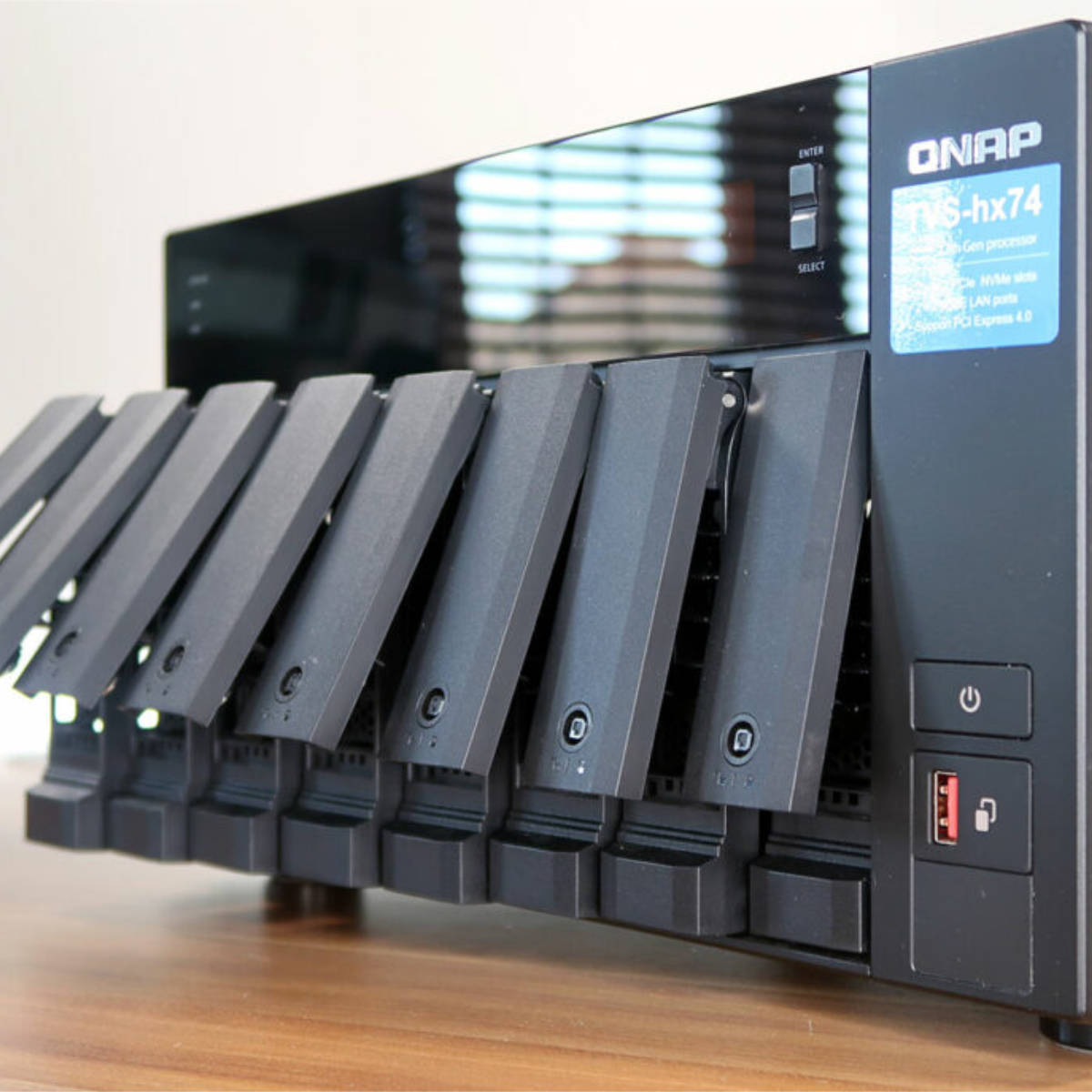 QNAP TVS-h874 with drive bays open.