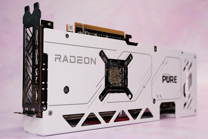 Sapphire Pure Radeon RX 7900 GRE graphics card, standing vertically against a pink backdrop.