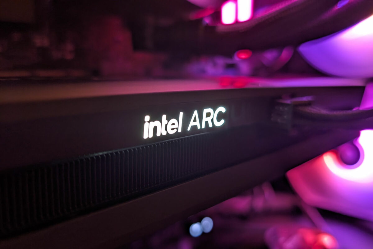 A view of Intel Arc B580 inside a system, its 'intel ARC' LEDs lit up in white.