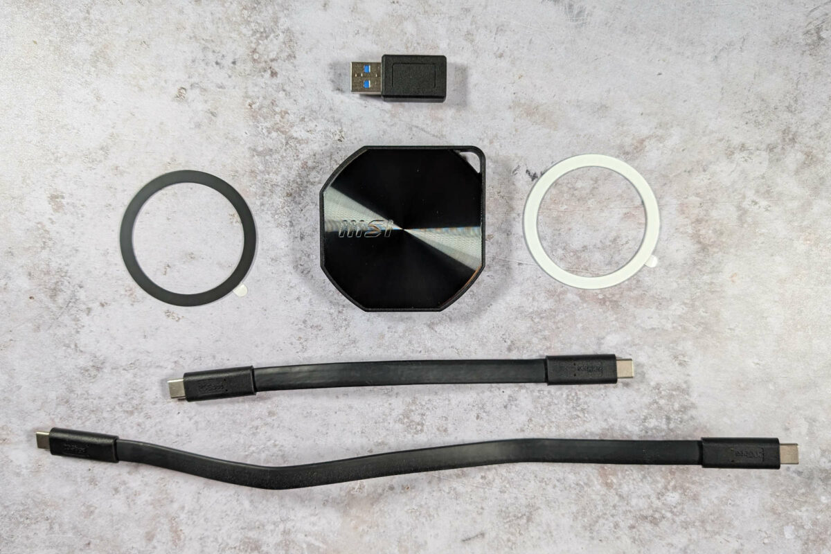 MSI Datamag 20Gbps accessories, including a USB Type-A adaptor, two metal rings, and two USB Type-C cables of varying lengths.