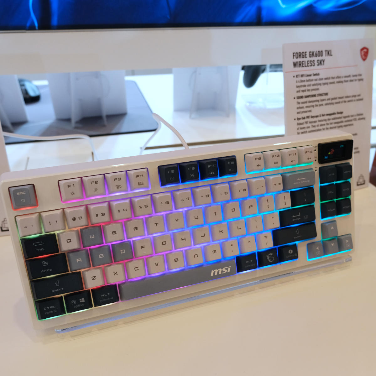 MSI Forge GK600 TKL Wireless Sky gaming keyboard propped up on a stand.