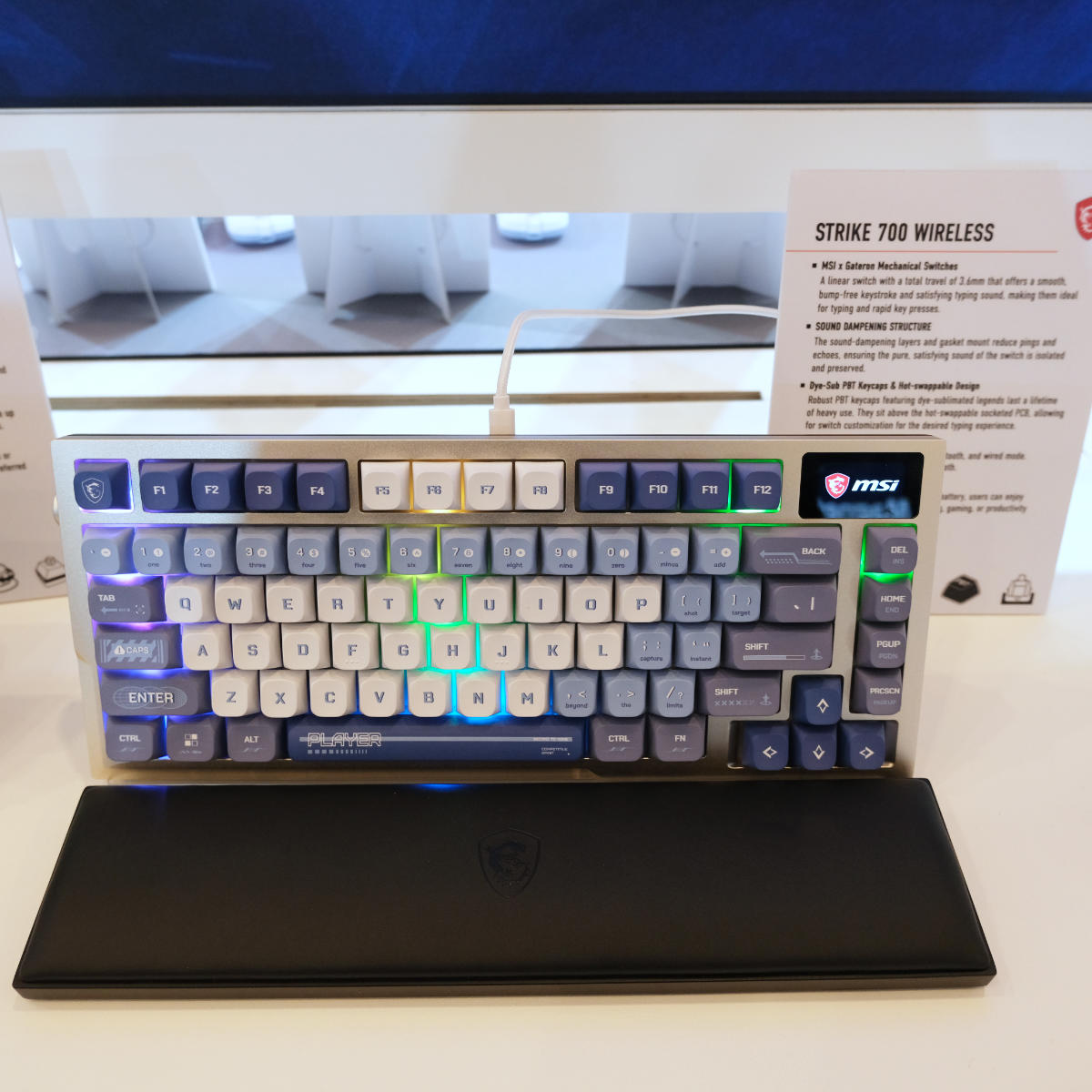 MSI Strike 700 Wireless gaming keyboard propped up on a stand.