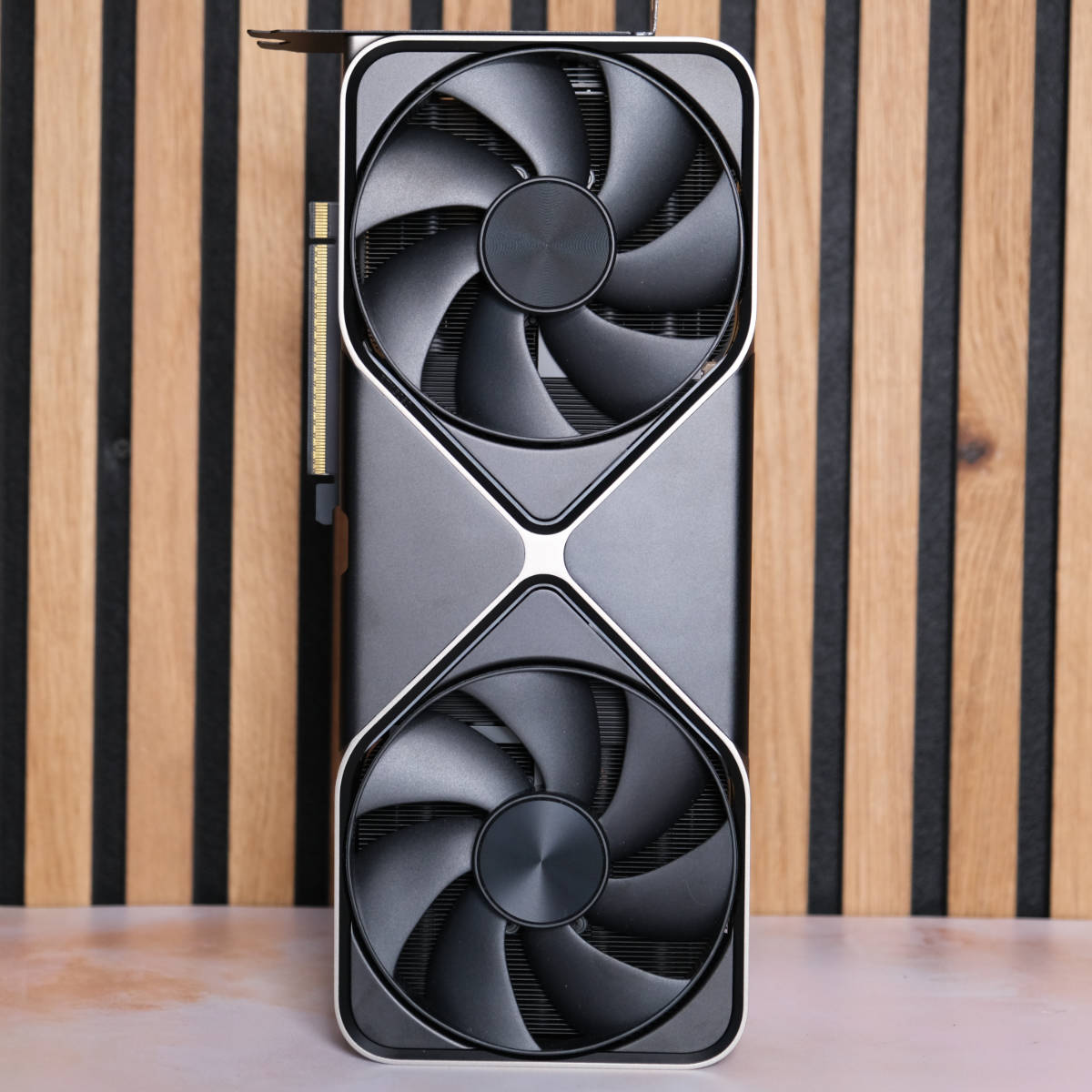 Nvidia GeForce RTX 5080 Founders Edition standing upright with fans facing forward.