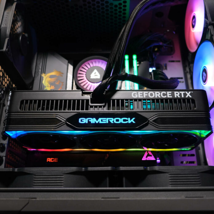 Palit GeForce RTX 5080 GameRock in the Club386 test bench, glowing RGB lighting.