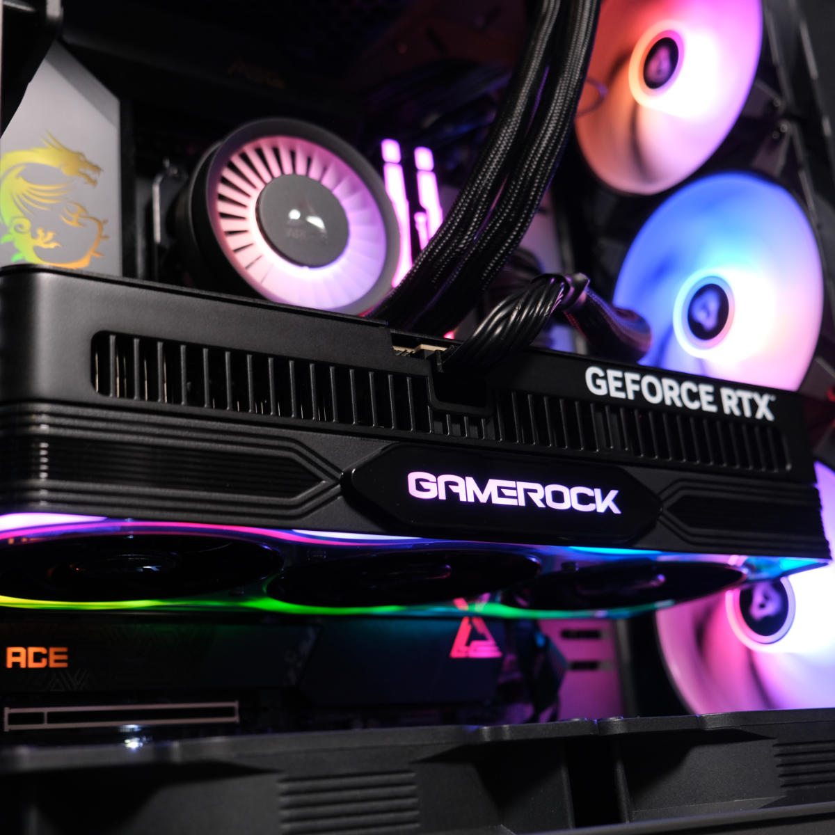 Palit GeForce RTX 5080 GameRock graphics card glowing pink.