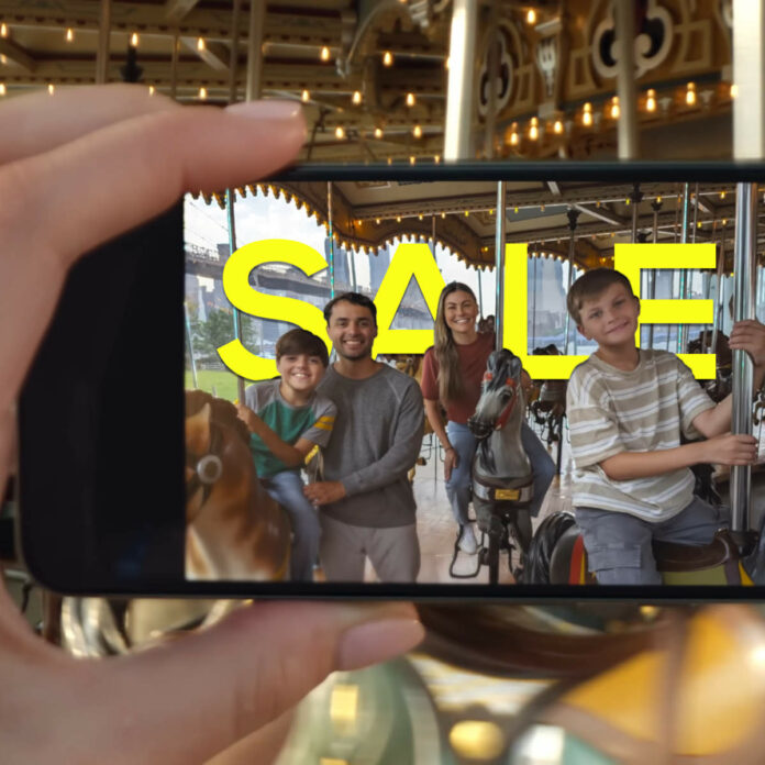 Google Pixel 8 Pro filming a family with the word 'sale' in the background.