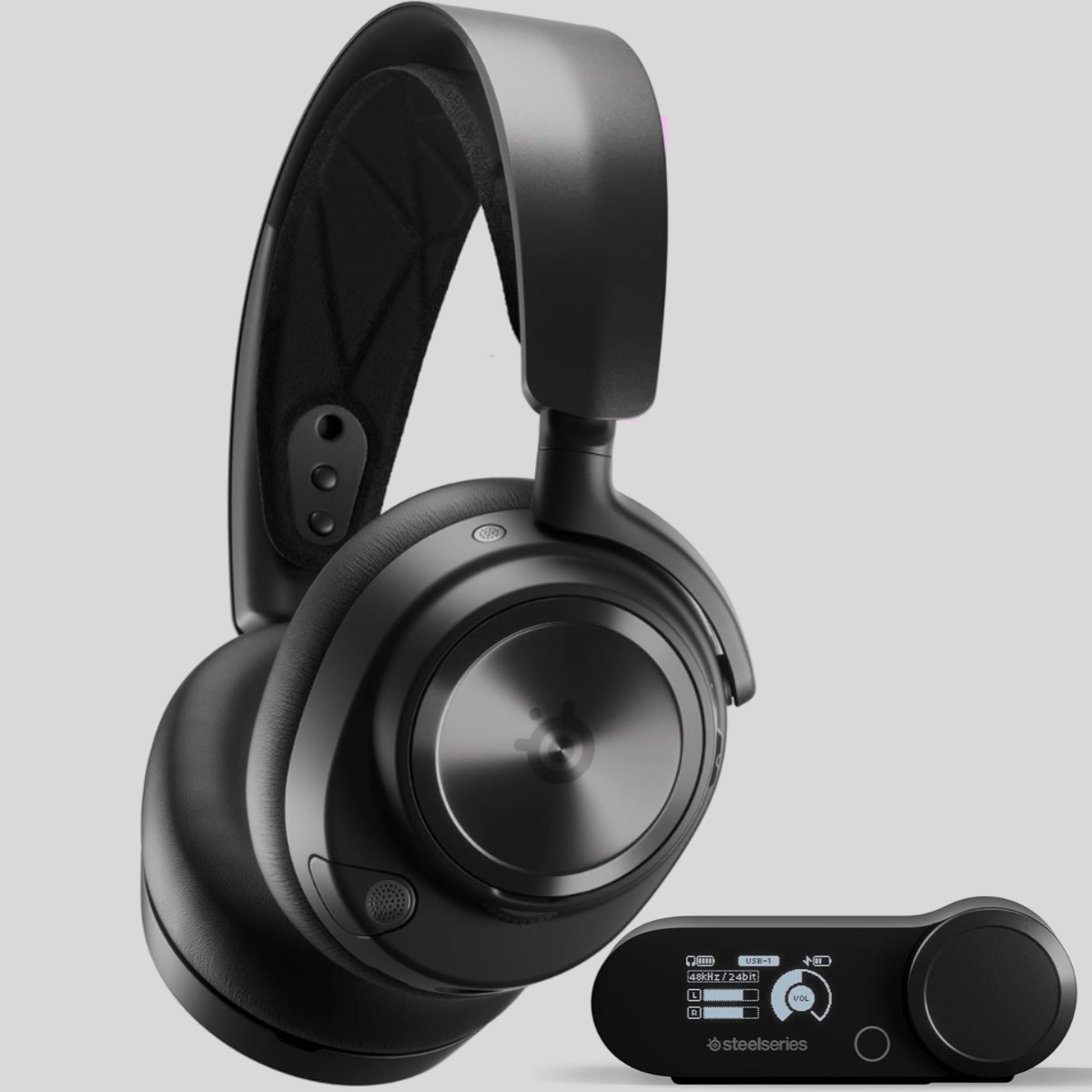 SteelSeries Arctis Nova Pro Wireless gaming headset alongside its OLED base station and two hot-swappable batteries.