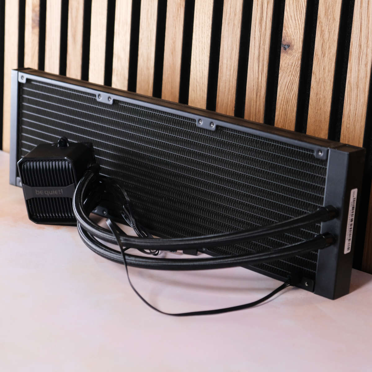 be quiet! Silent Loop 3 pump and radiator against wood panels.