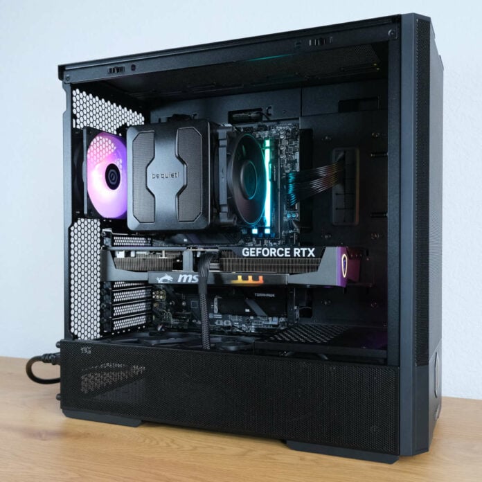 Wide shot of CyberpowerPC Ultra 5080, atop a wooden surface against a white backdrop.