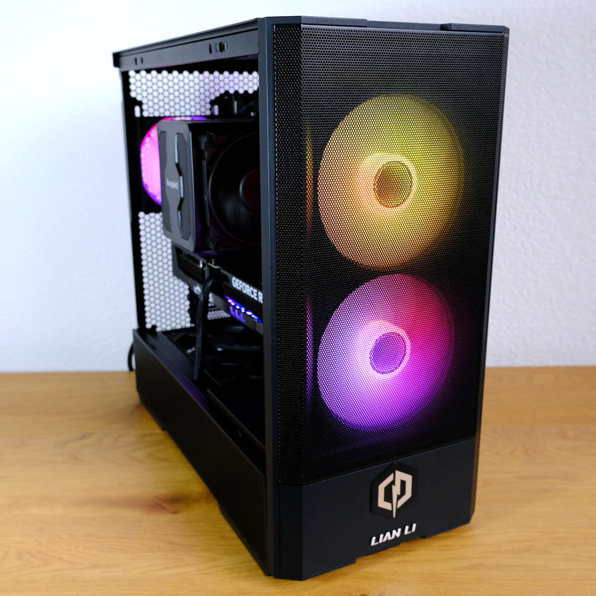 A side-on view of CyberpowerPC Ultra 5080, showing the two fans at its front and internal components.