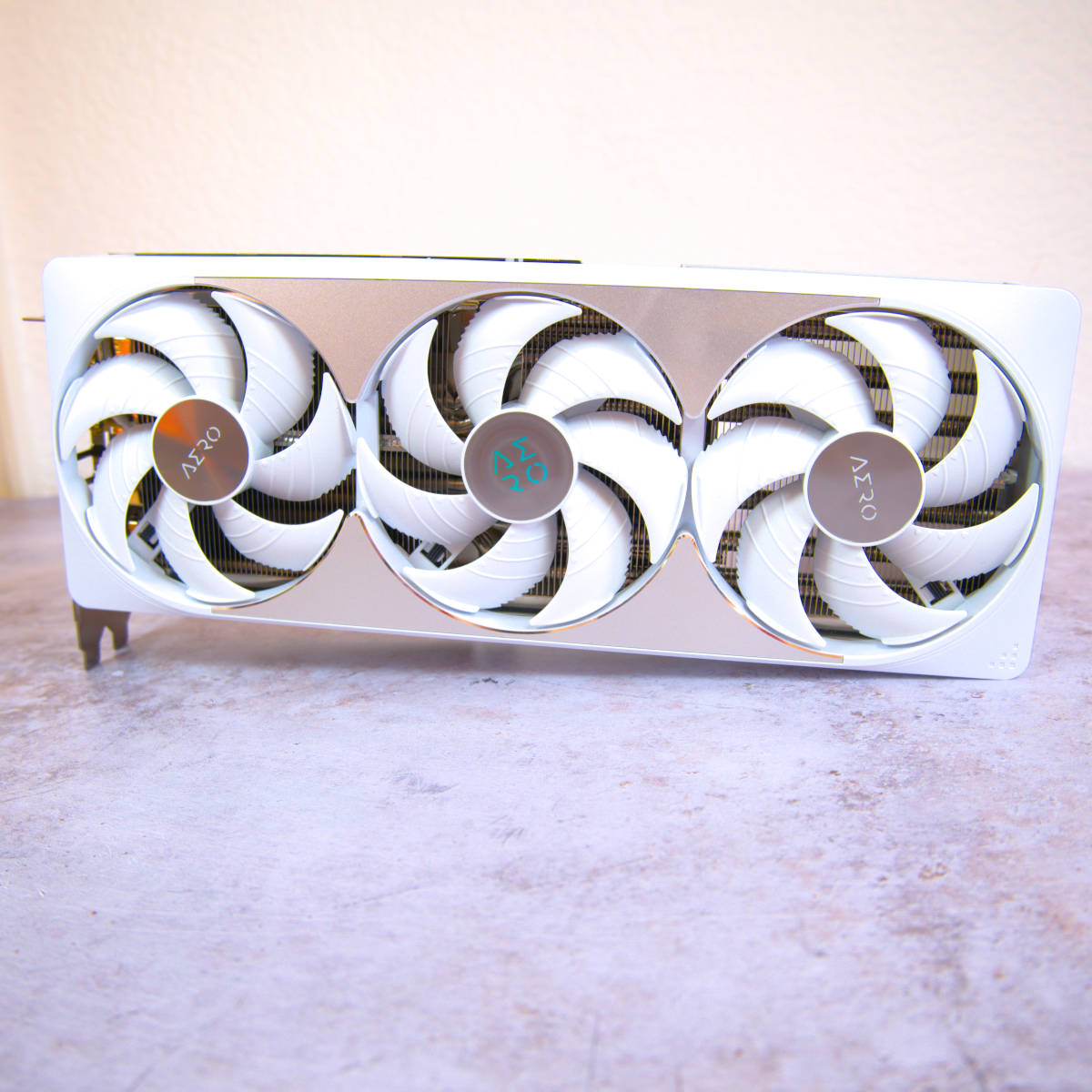 Wide shot of Gigabyte GeForce RTX 5080 Aero OC SFF, displaying its triple fan configuration.