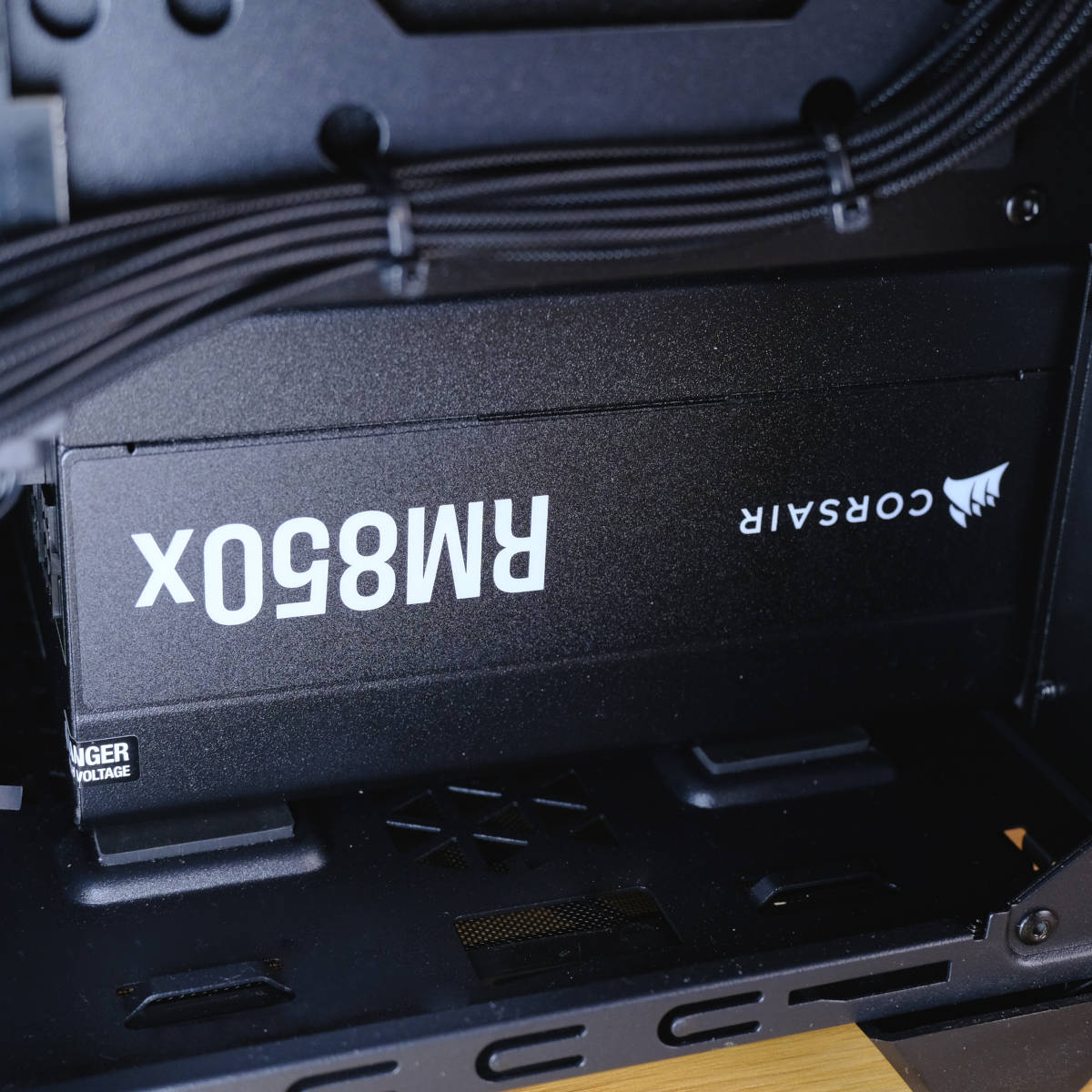 Close up of Corsair RM850x power supply in PCSpecialist Nebulra Ultra R.