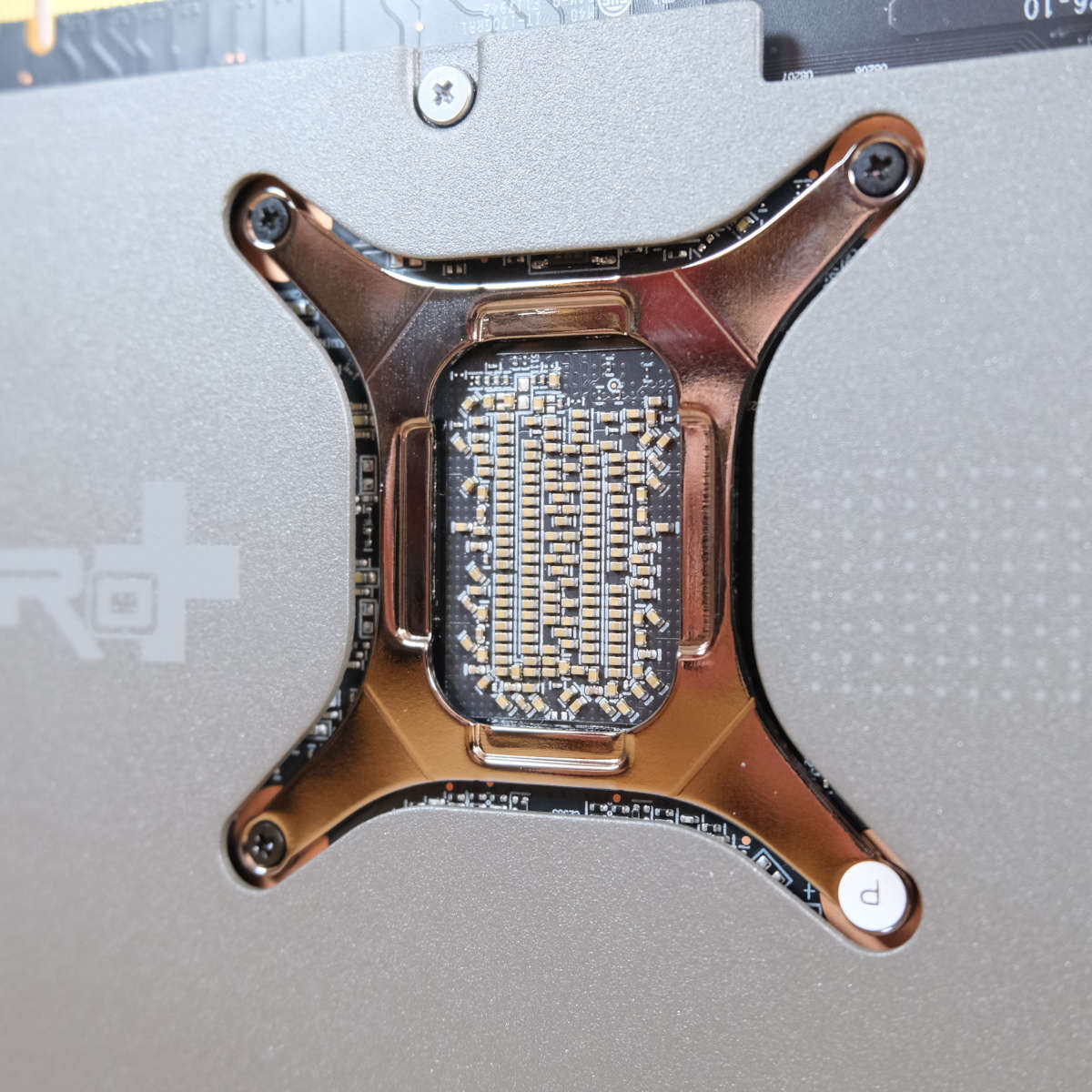 Close up of Sapphire Nitro+ Radeon RX 9070 XT backplate, focussing on exposed PCB.