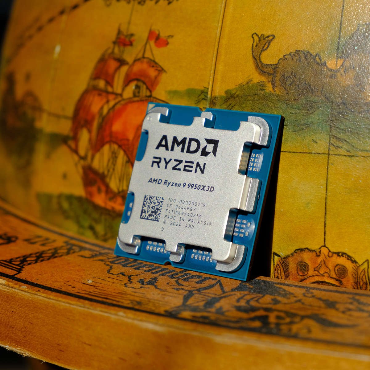 AMD Ryzen 9 9950X3D resting against a drinks globe.