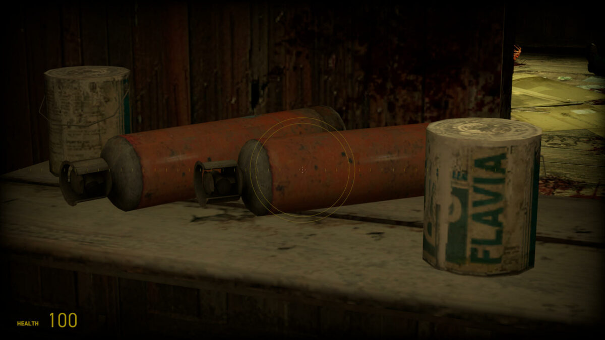 Two bottles of propane and a paint can sit atop a table in Half-Life 2.