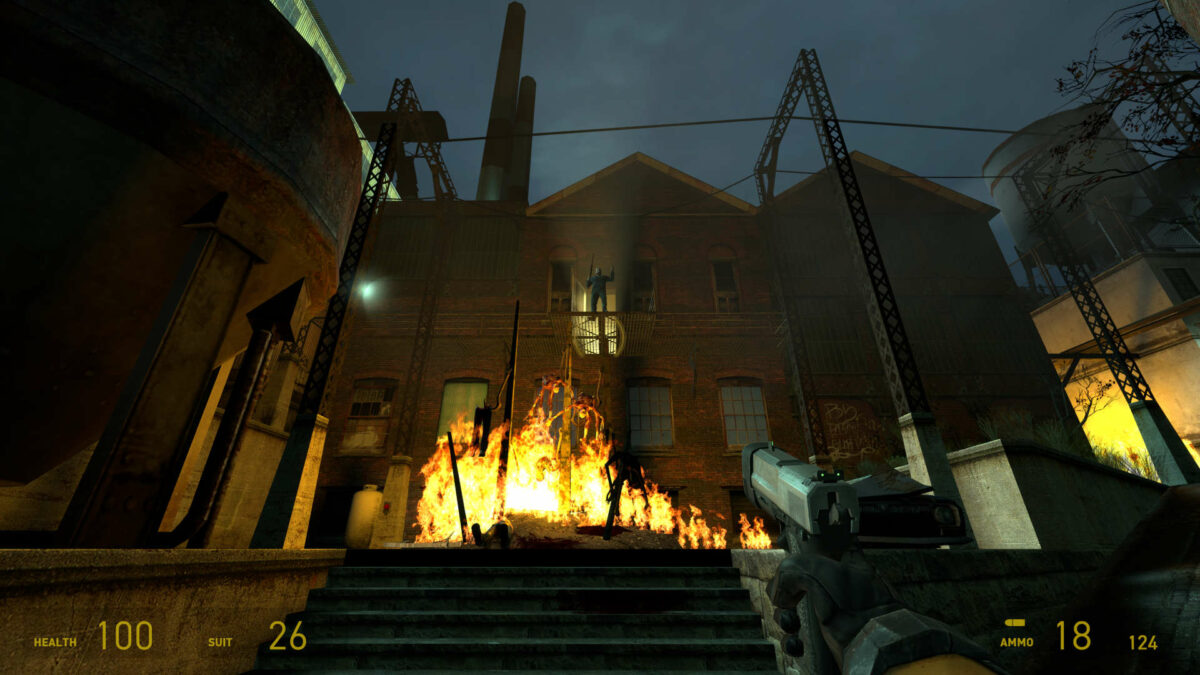 A burning pyre of corpses, with Father Grigori standing above them in Half-Life 2.