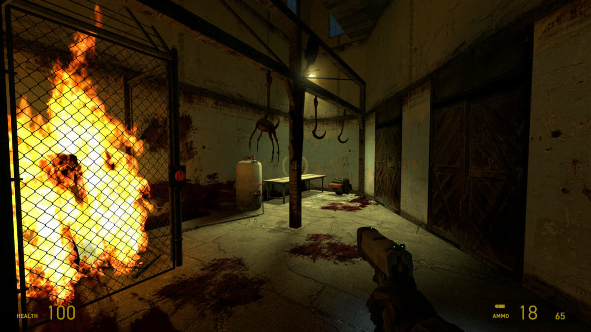 A headcrab zombie lights up a room as they burn in Half-Life 2.