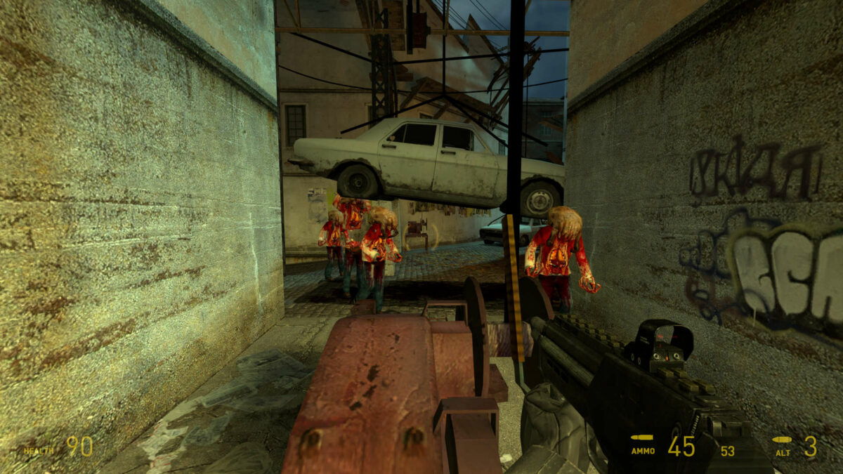 Headcrab zombies trudge towards the player, their horde partially squished by a car in Half-Life 2.