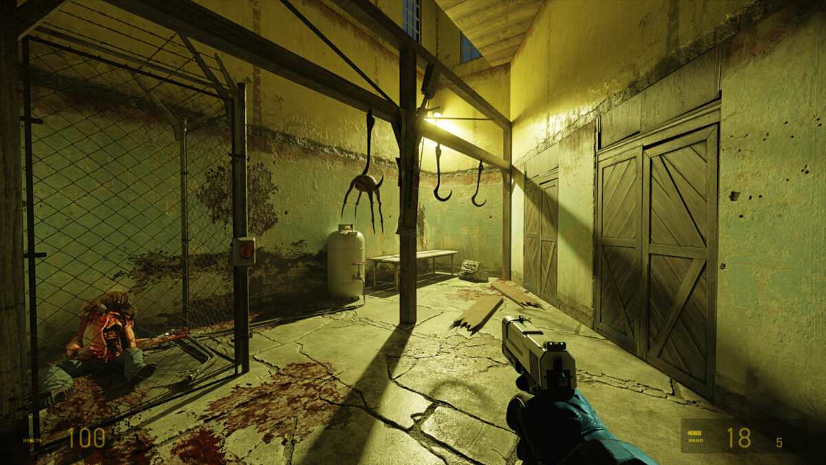 A room with a headcrab hanging from a hook and zombie in the left corner, in Half-Life 2 RTX.